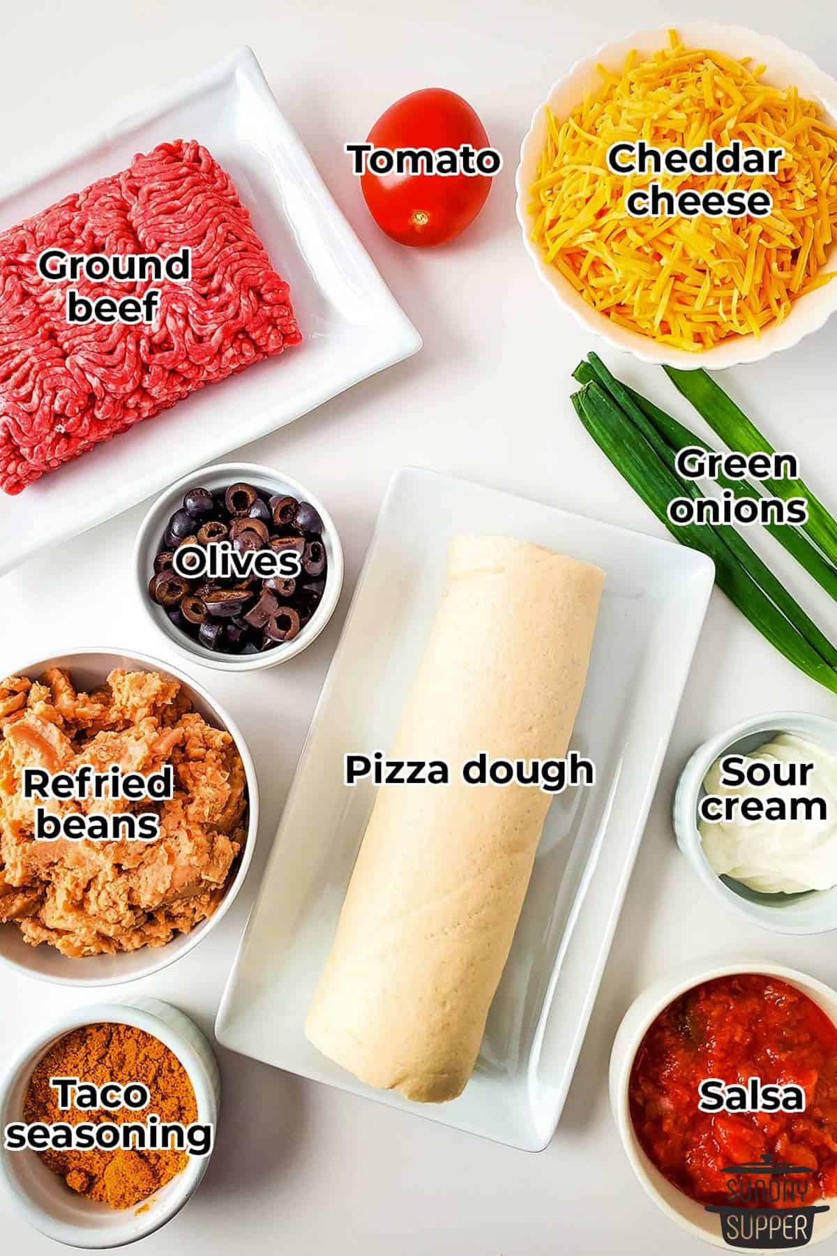 all the ingredients for taco pizza with labels