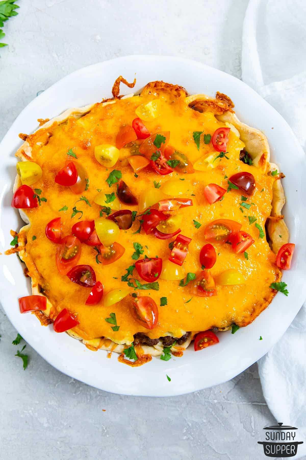 a completed cheeseburger pie in a serving dish