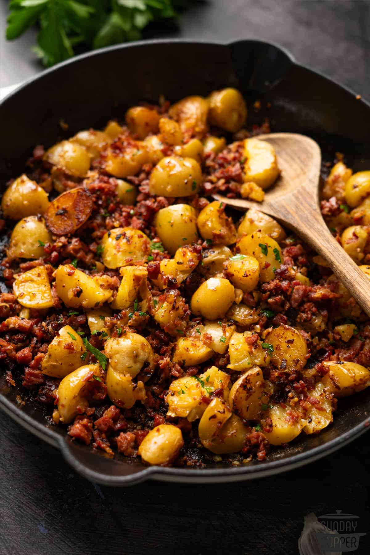 a cast iron pan filled with corned beef hash