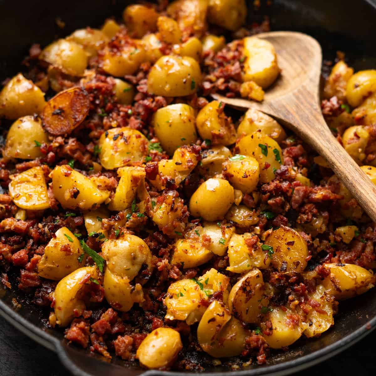 a pan filled with crispy corned beef hash