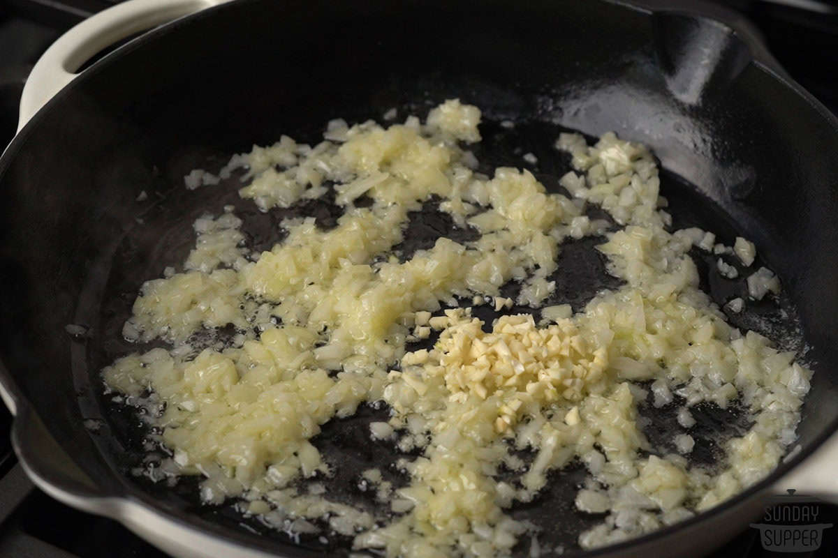 the onions and garlic added to the pan of butter