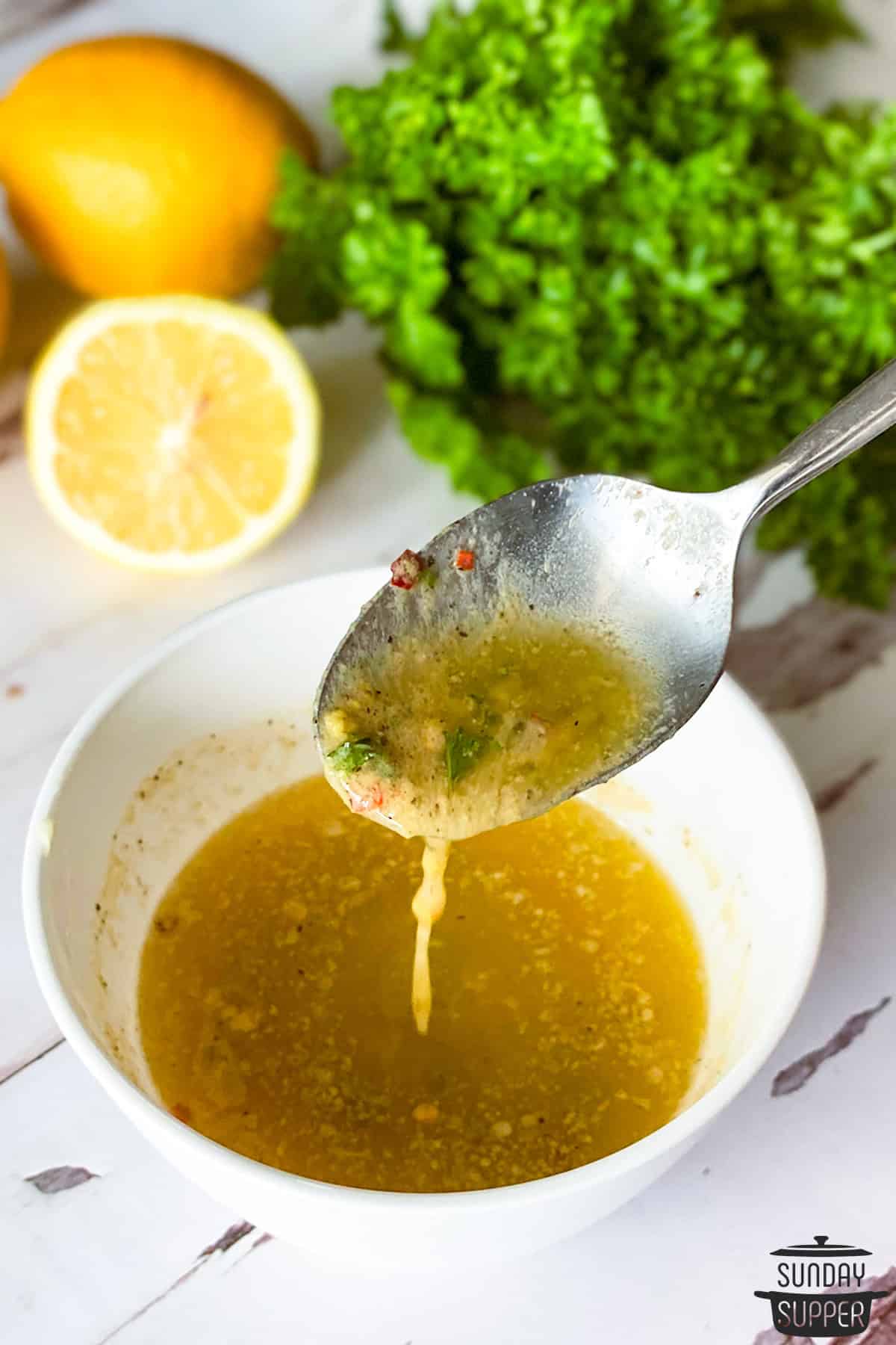 cowboy butter sauce in a bowl with a spoon