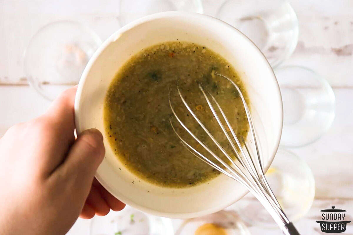 mixing cowboy butter with a whisk in a bowl