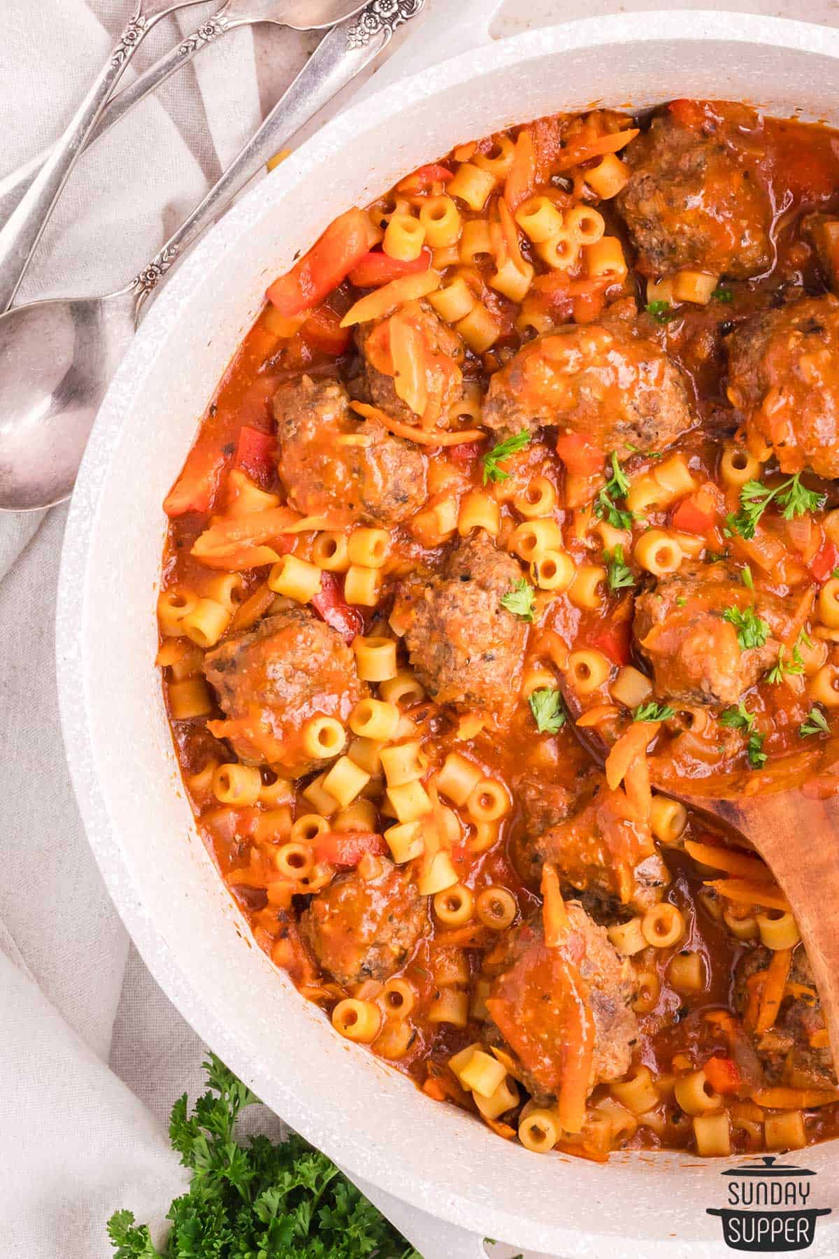 a pot filled with completed meatball soup