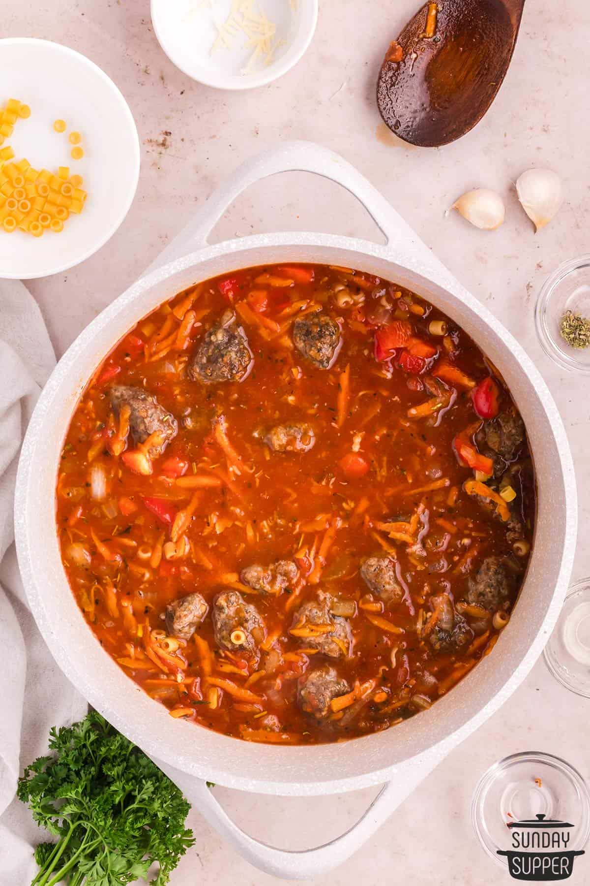 the soup with tomatoes, pasta, and meatballs added