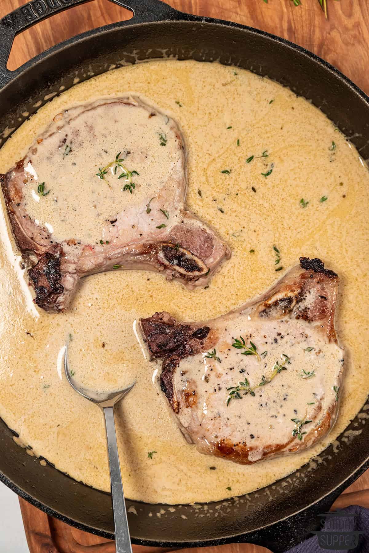 pork chops with mustard sauce in a pan