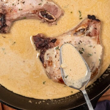 pouring mustard sauce over pork chops