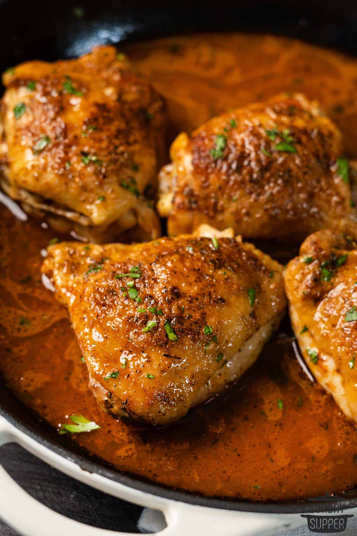 pan fried chicken thighs in a pan