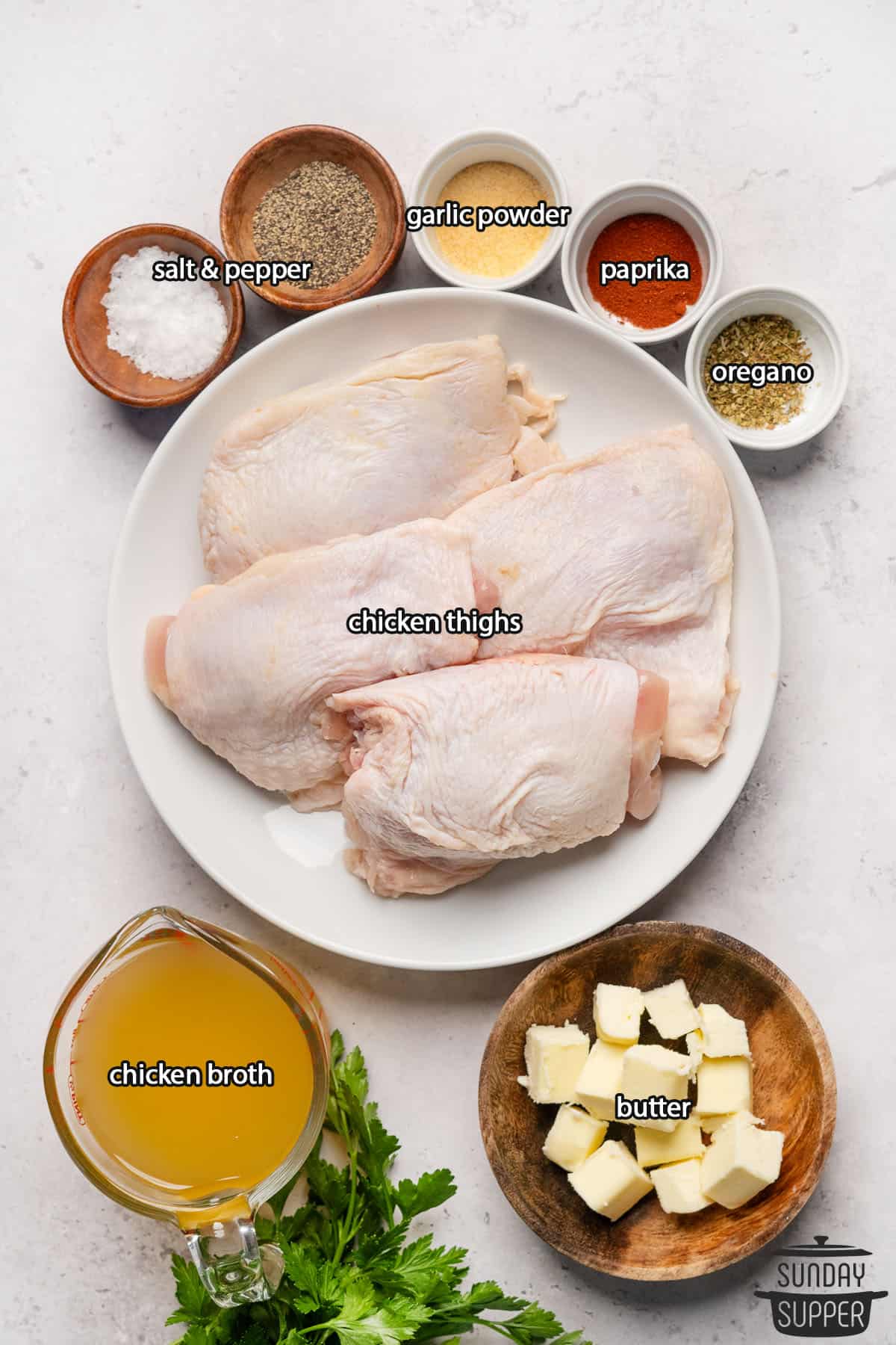 all the ingredients for pan seared chicken thighs with labels