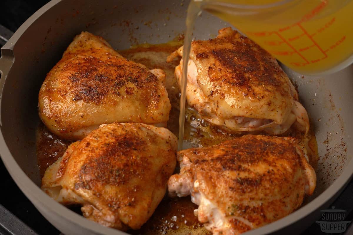 the broth being added to the pot