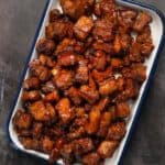 closeup of pork belly burnt ends oven recipe in baking dish