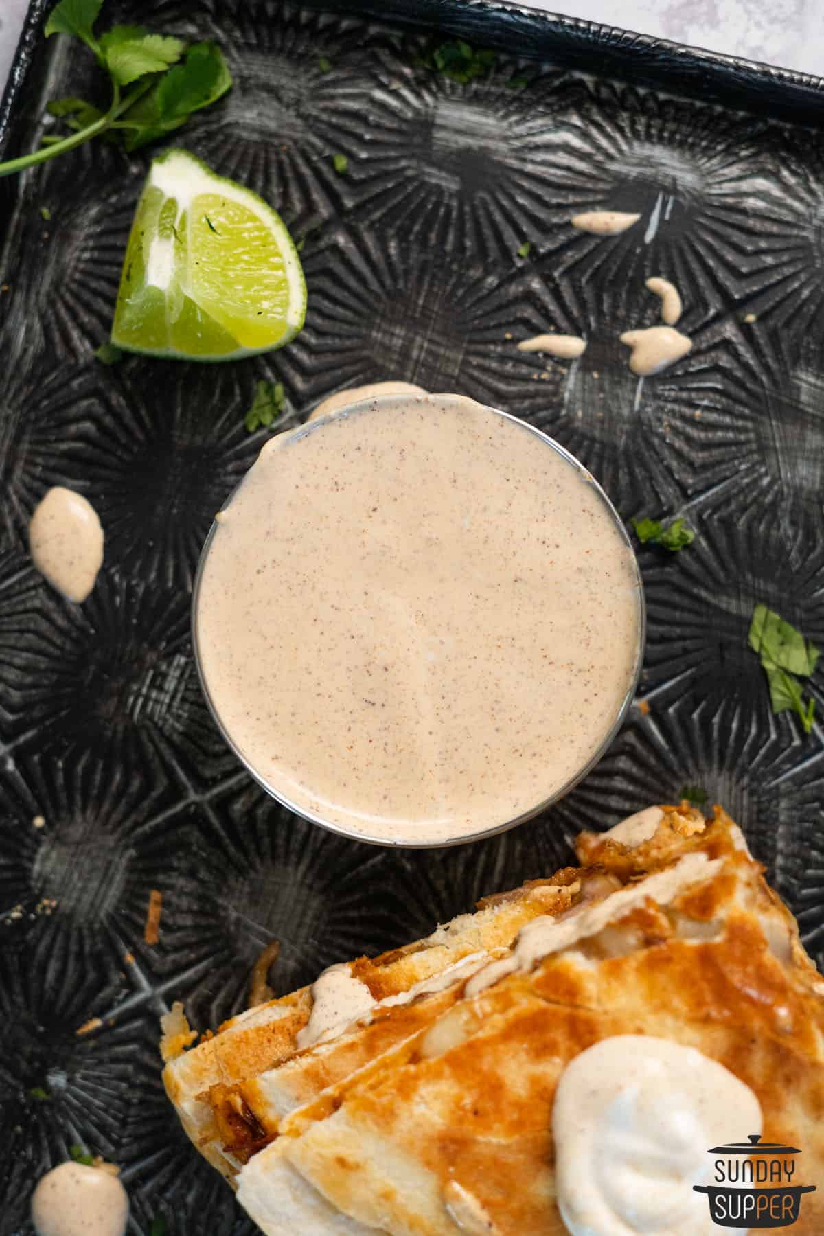 quesadilla sauce in a bowl with quesadilla slices