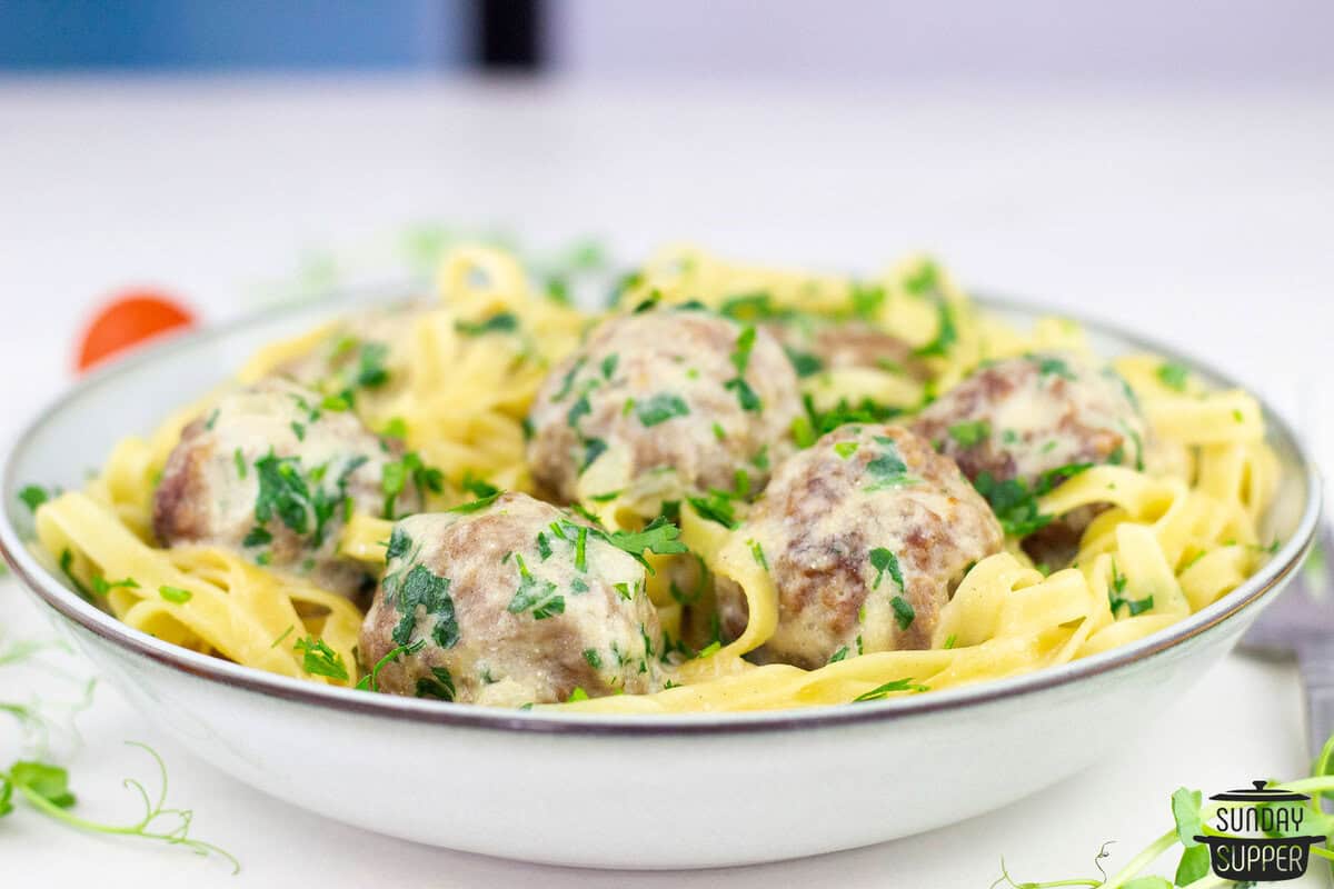 a bowl of noodles with swedish meatballs