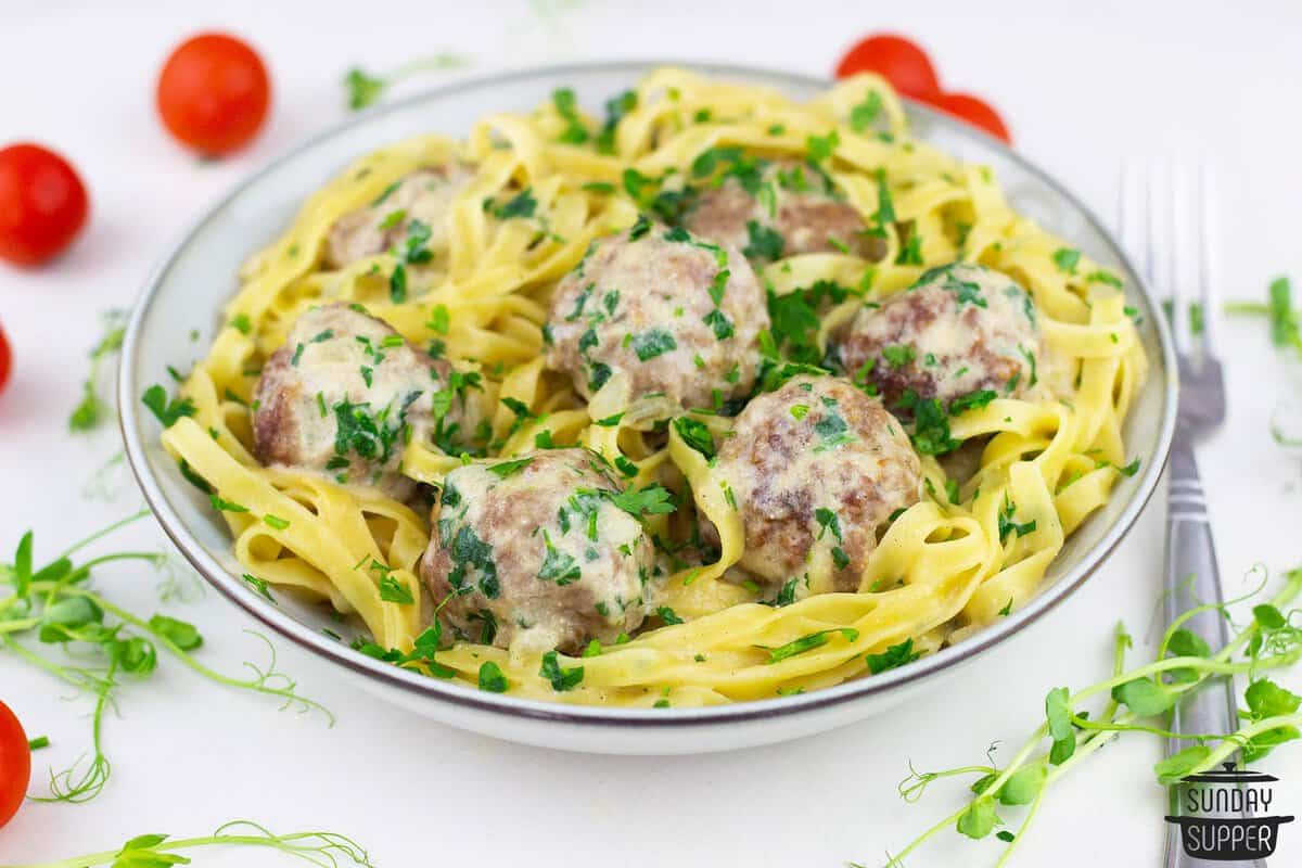 a serving bowl of swedish meatballs with pasta