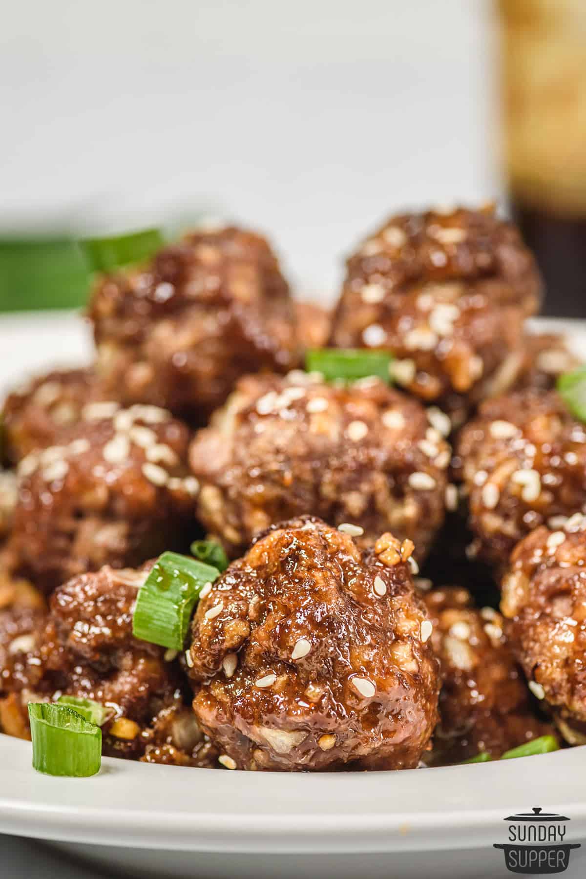 a plate of honey sriracha meatballs