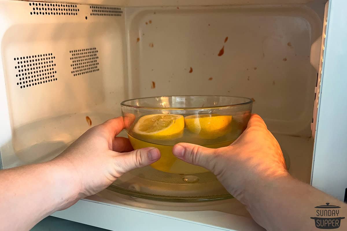 placing the water and lemon bowl in the microwave