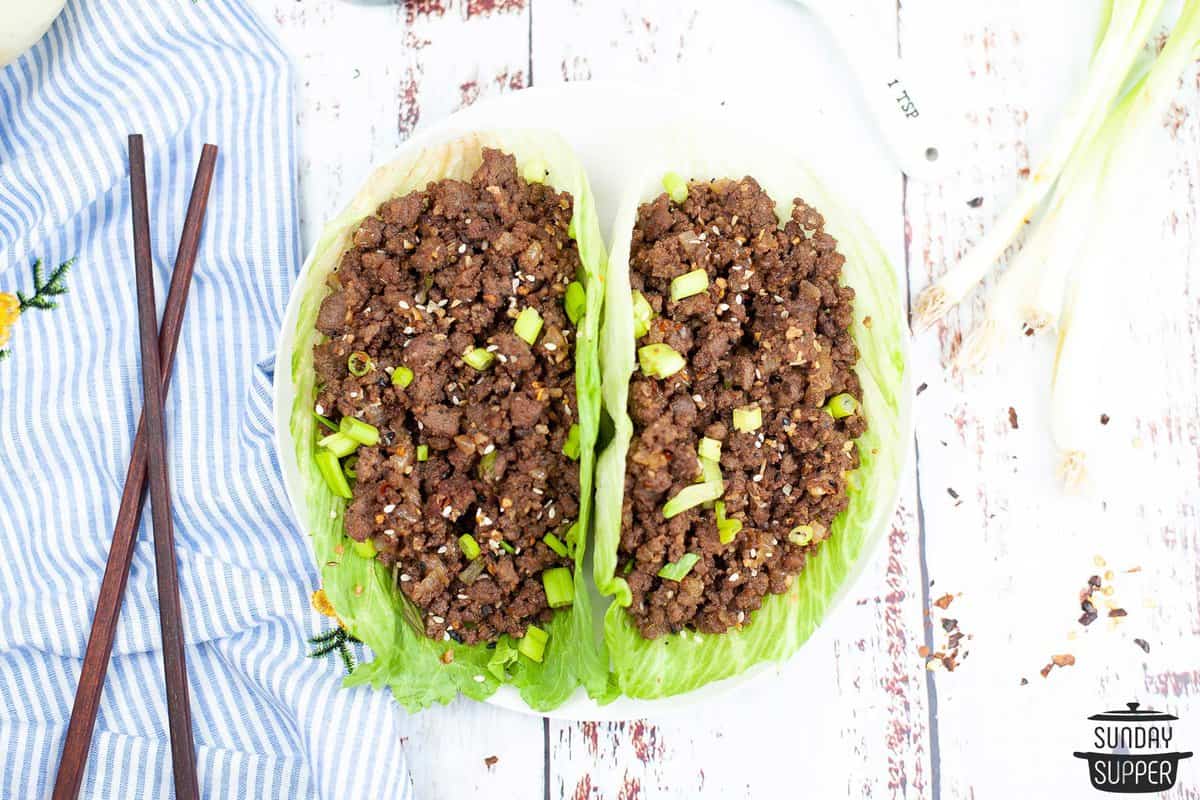 ground beef added to lettuce wraps ready to serve