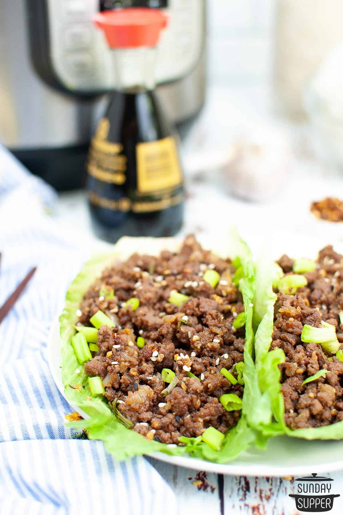 a closeup of a korean ground beef lettuce wrap