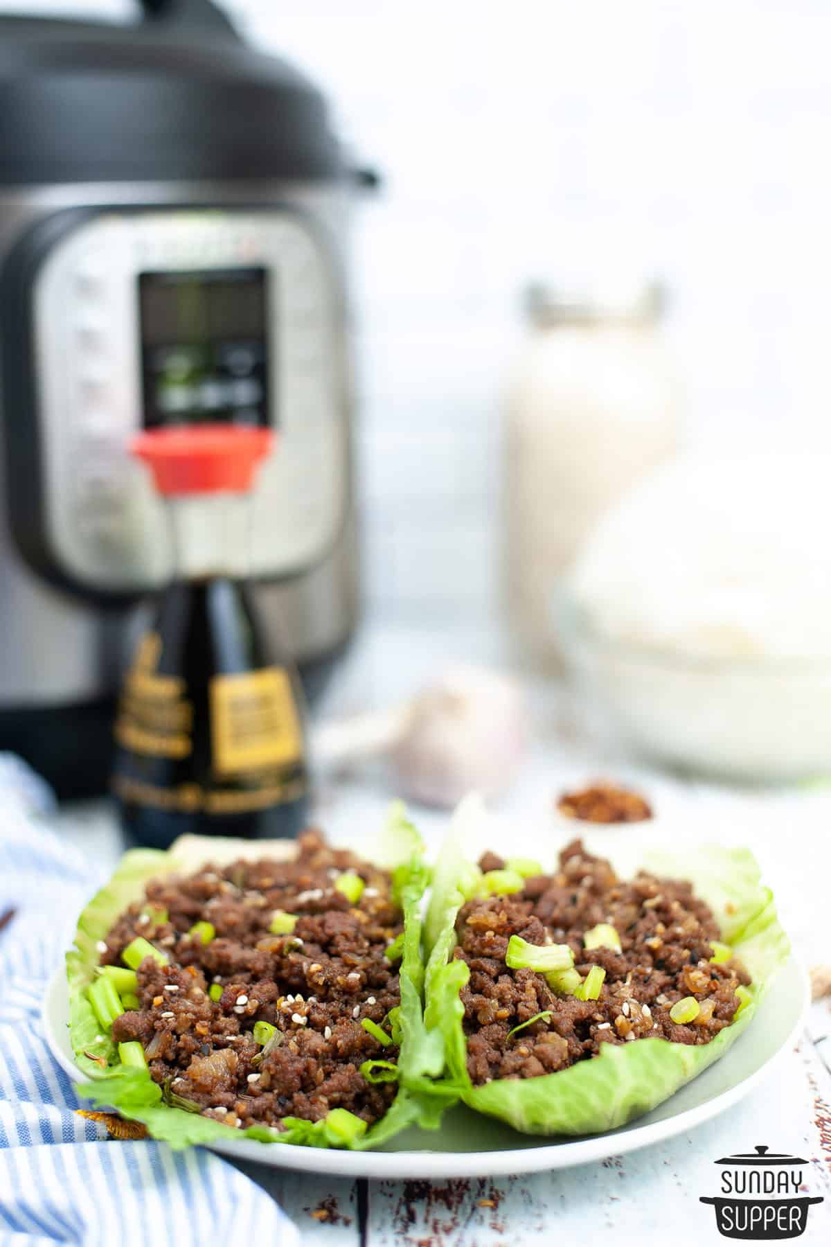 ground beef lettuce wraps in front of the instant pot