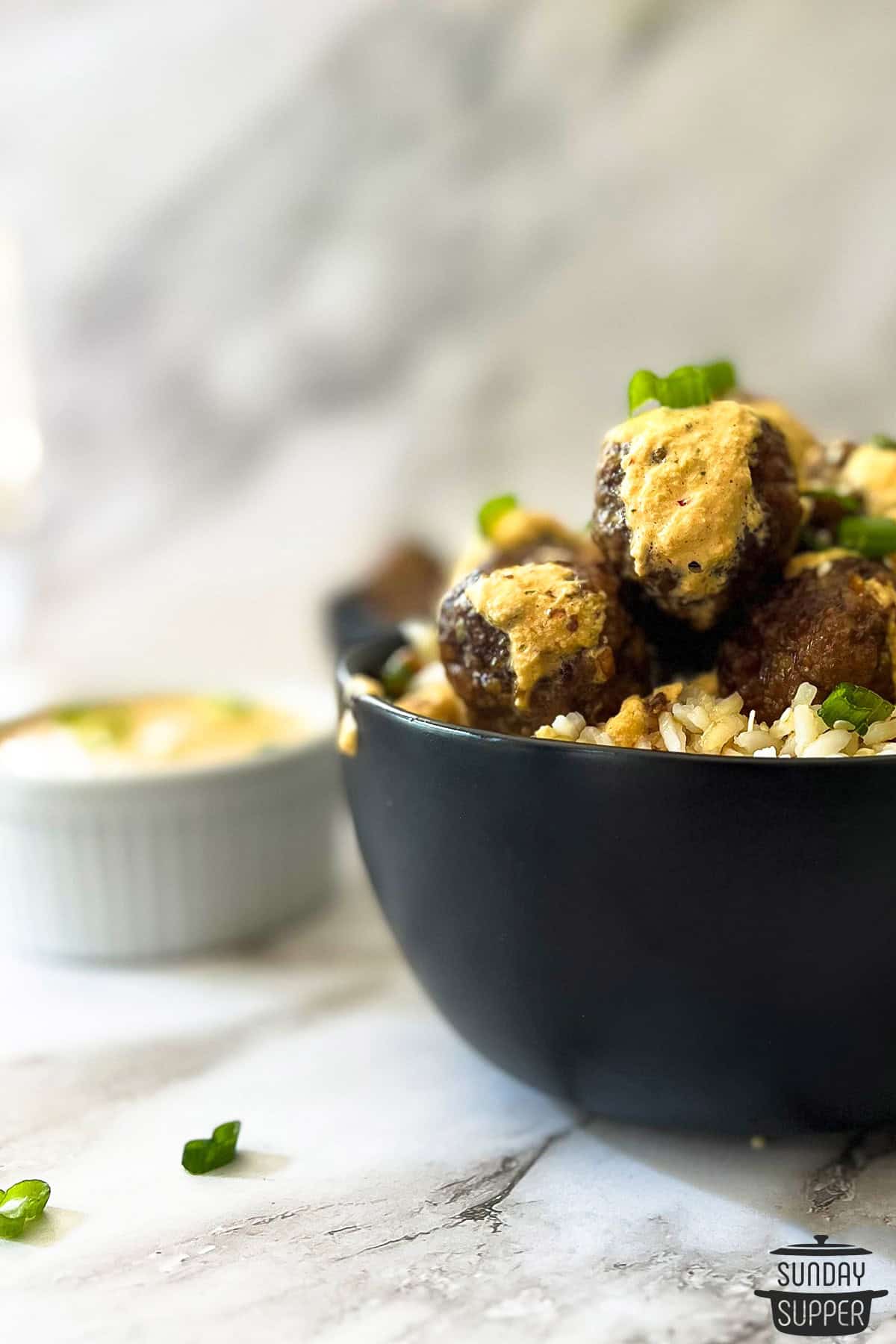 a bowl of korean meatballs and rice