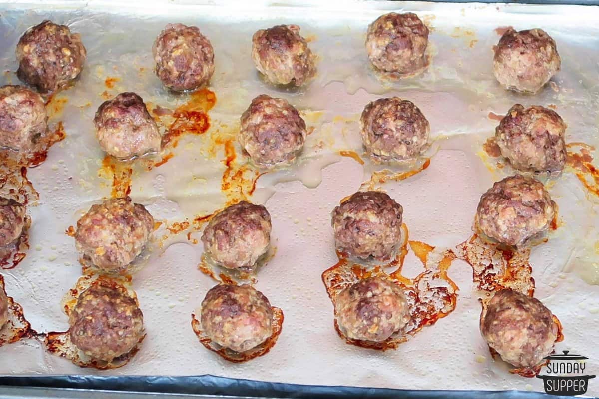 baked meatballs on a baking sheet