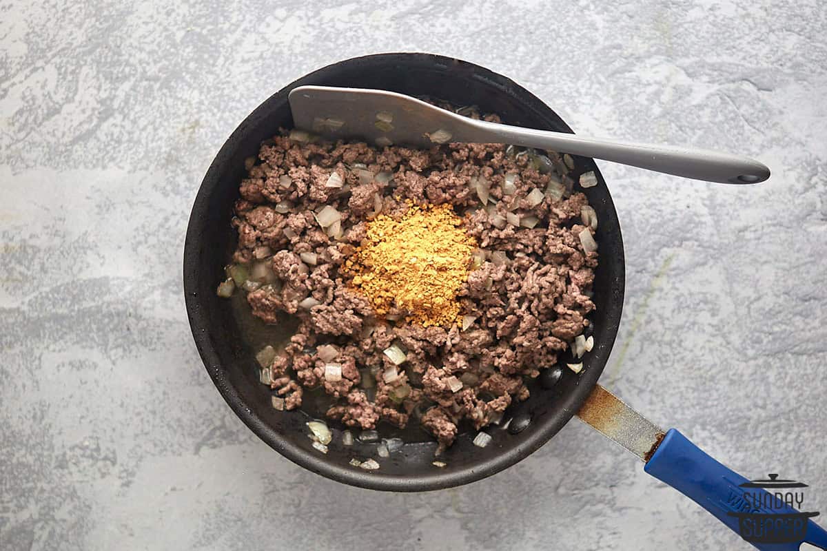 enchilada beef being cooked in a pan