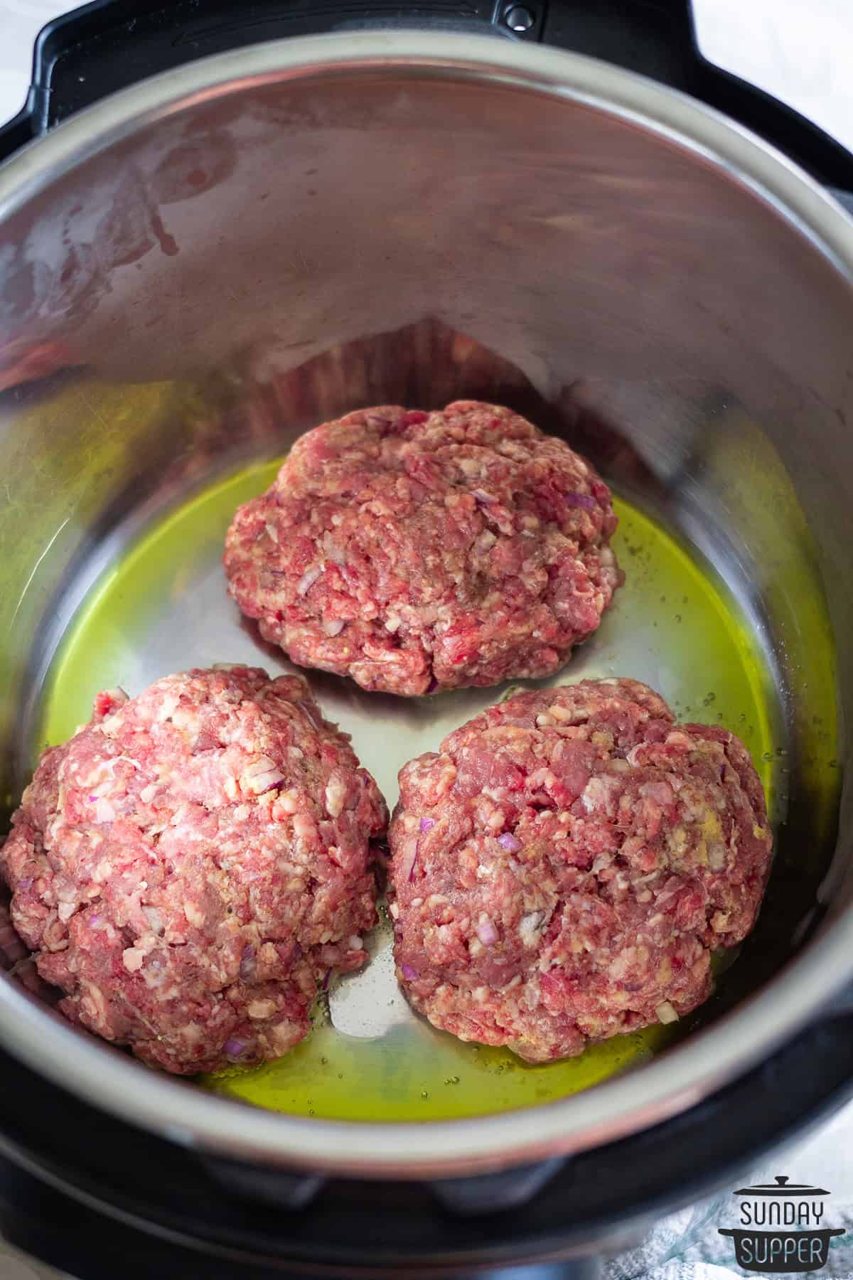 steaks added to the pot to be browned