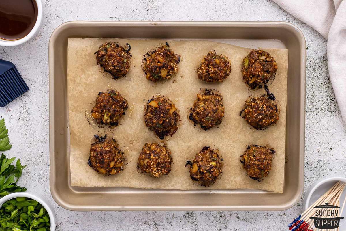 baked meatballs on a baking sheet