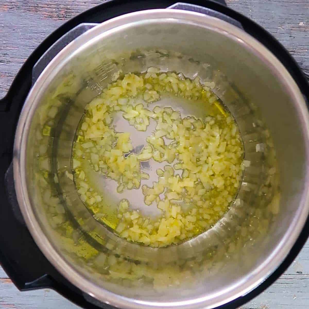 Onions cooking in a pot for Italian wedding soup