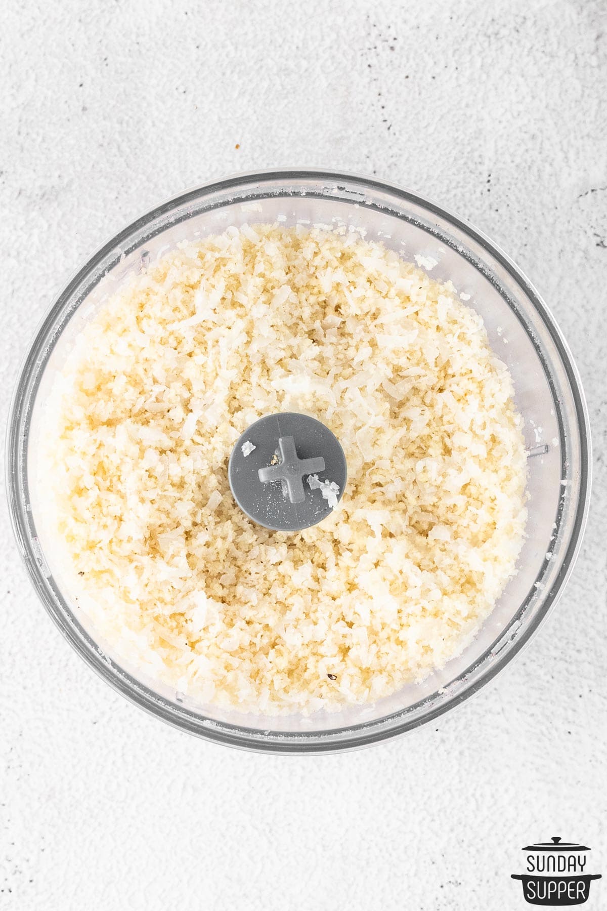 coconut flakes and panko in a blender after being mixed