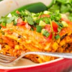 a closeup of the layers of beef enchilada casserole