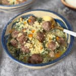 A bowl of Italian wedding meatball soup