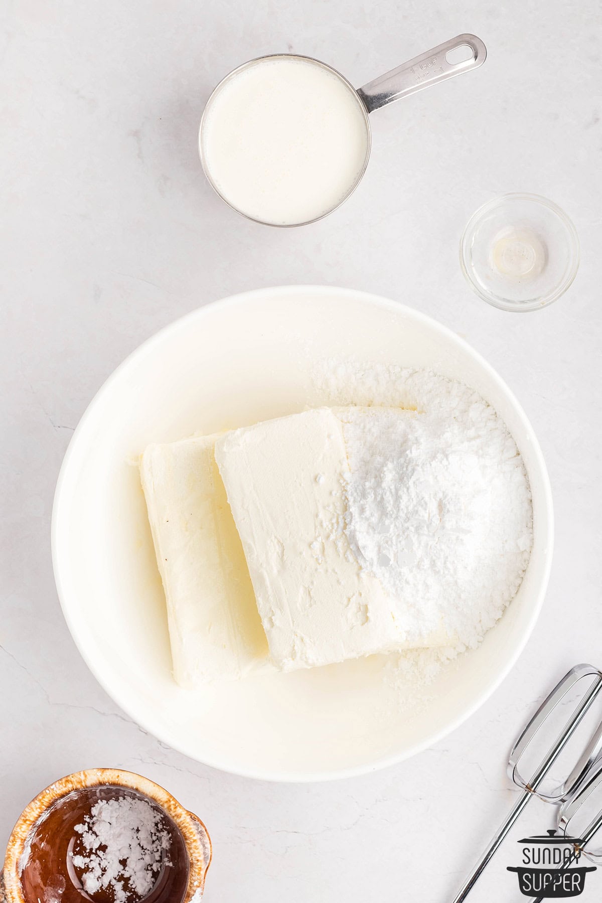 cream cheese and powdered sugar in a mixing bowl to come to room temperature