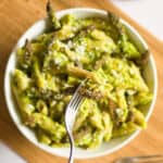 a fork full of asparagus and pea pasta