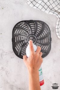 spraying air fryer basket