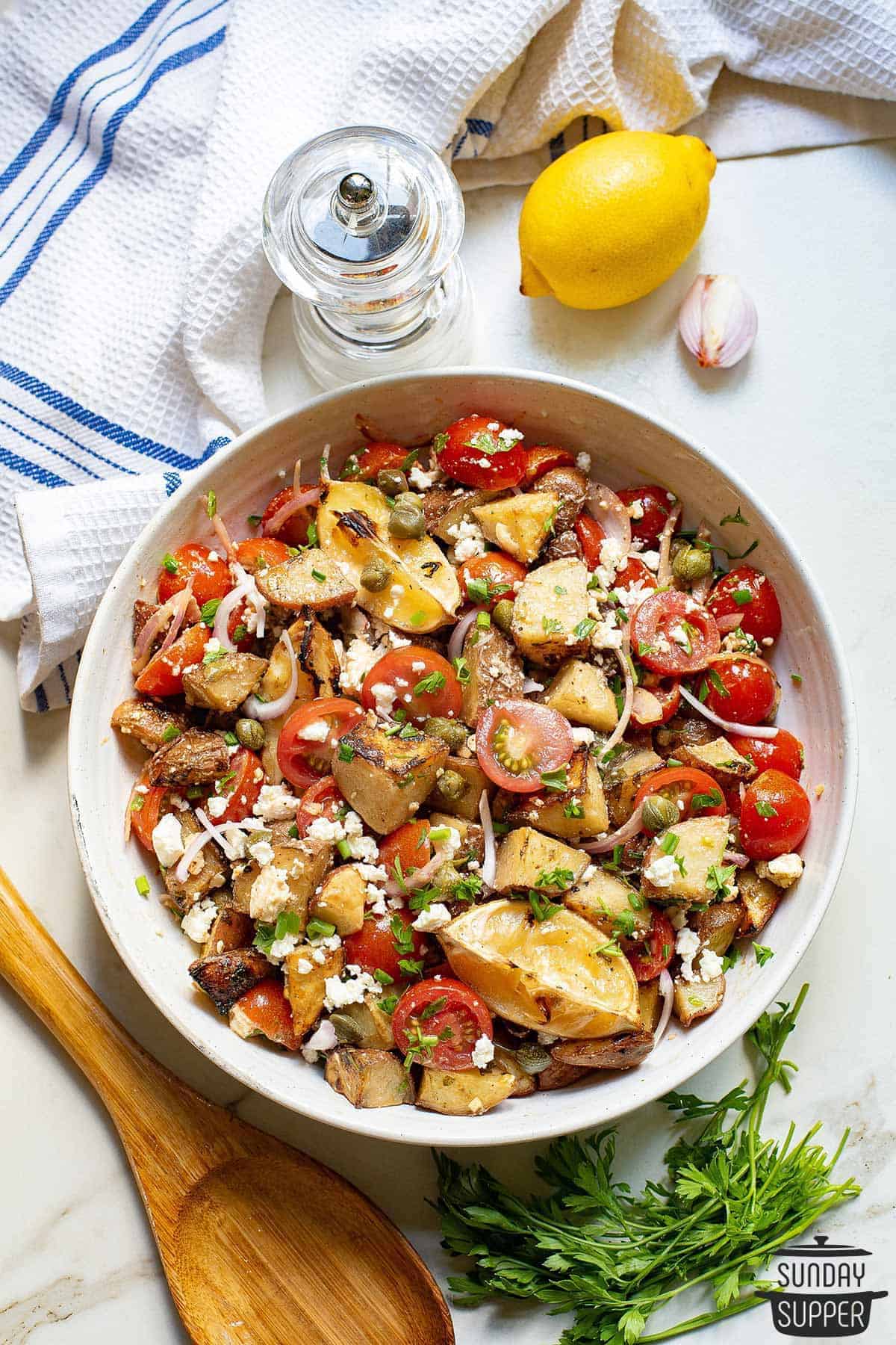 a bowl of lemon potato salad
