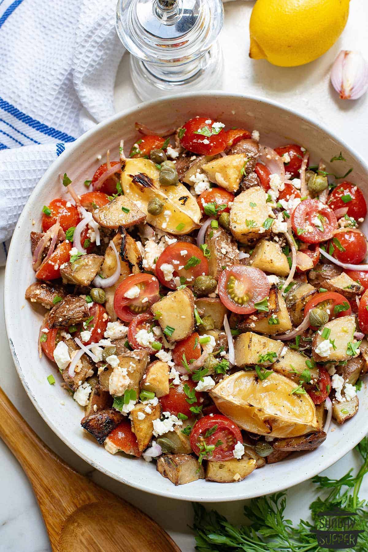 a plate full of greek potato salad