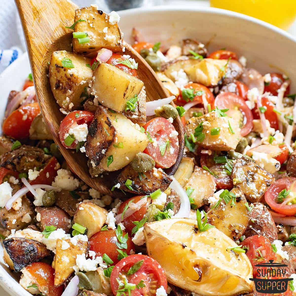 a spoon full of lemon potato salad