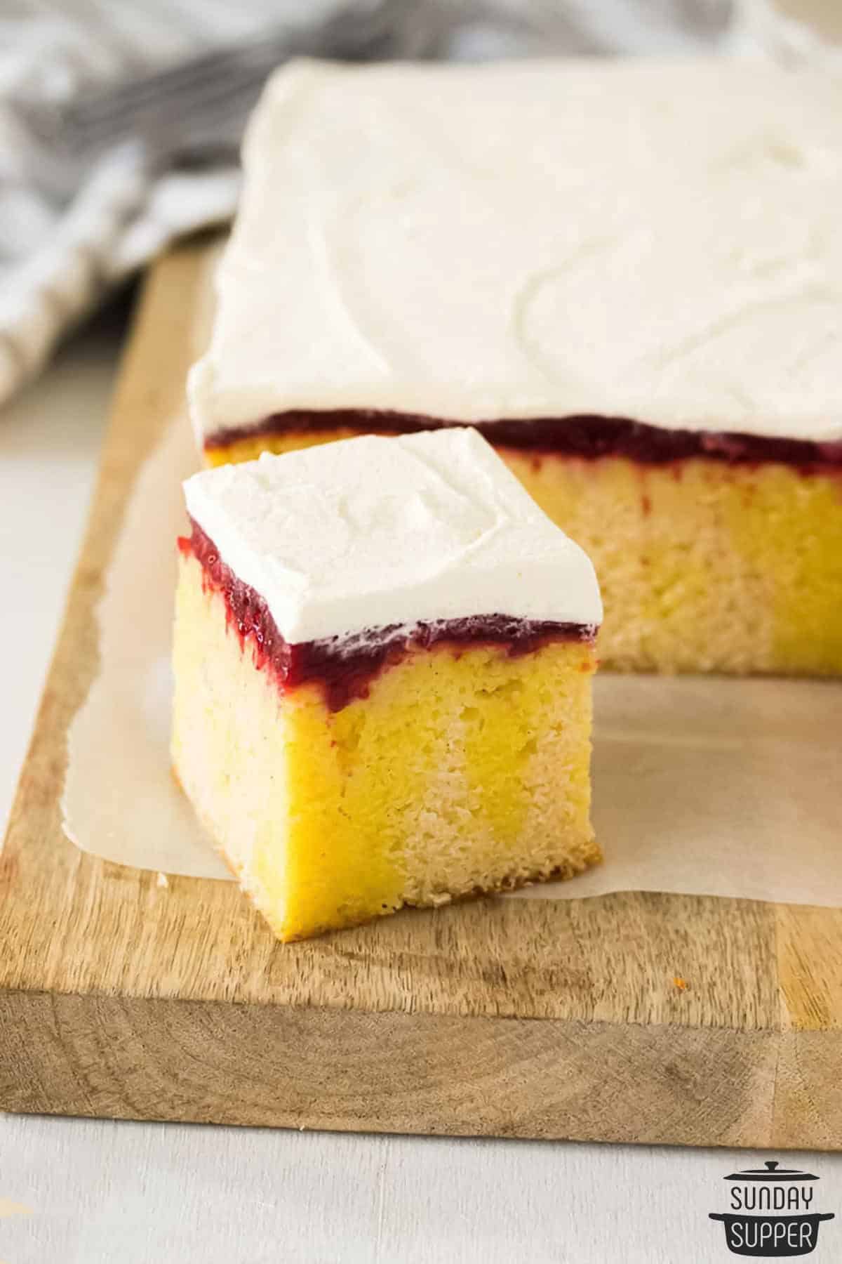 a slice of lemon poke cake