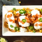 layered taco dip in a serving dish
