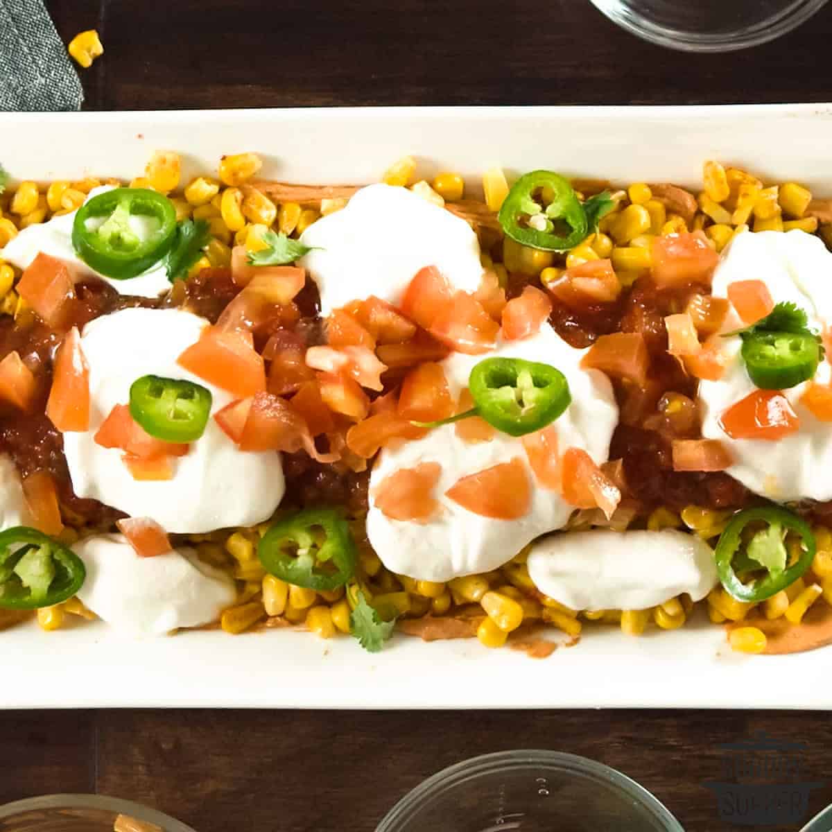 mexican layer dip in a serving dish