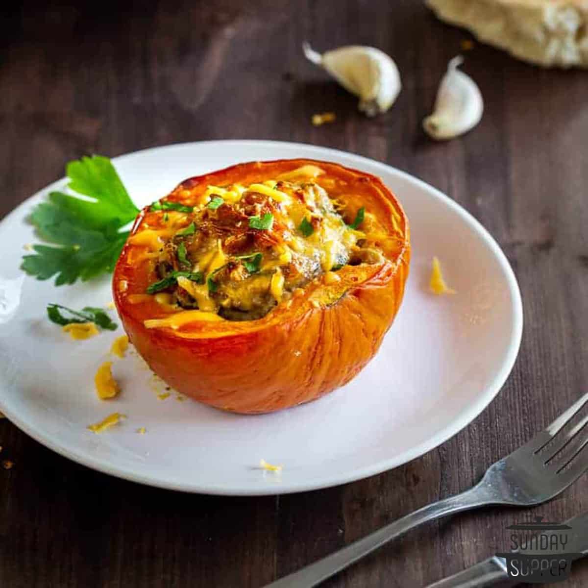 a stuffed squash on a dinner plate