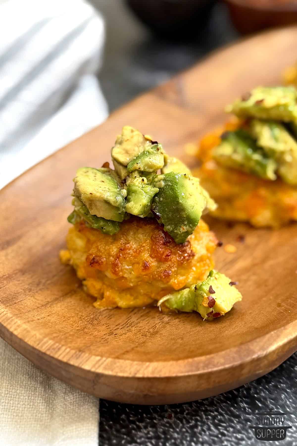 a platter with avocado toast chicken bites