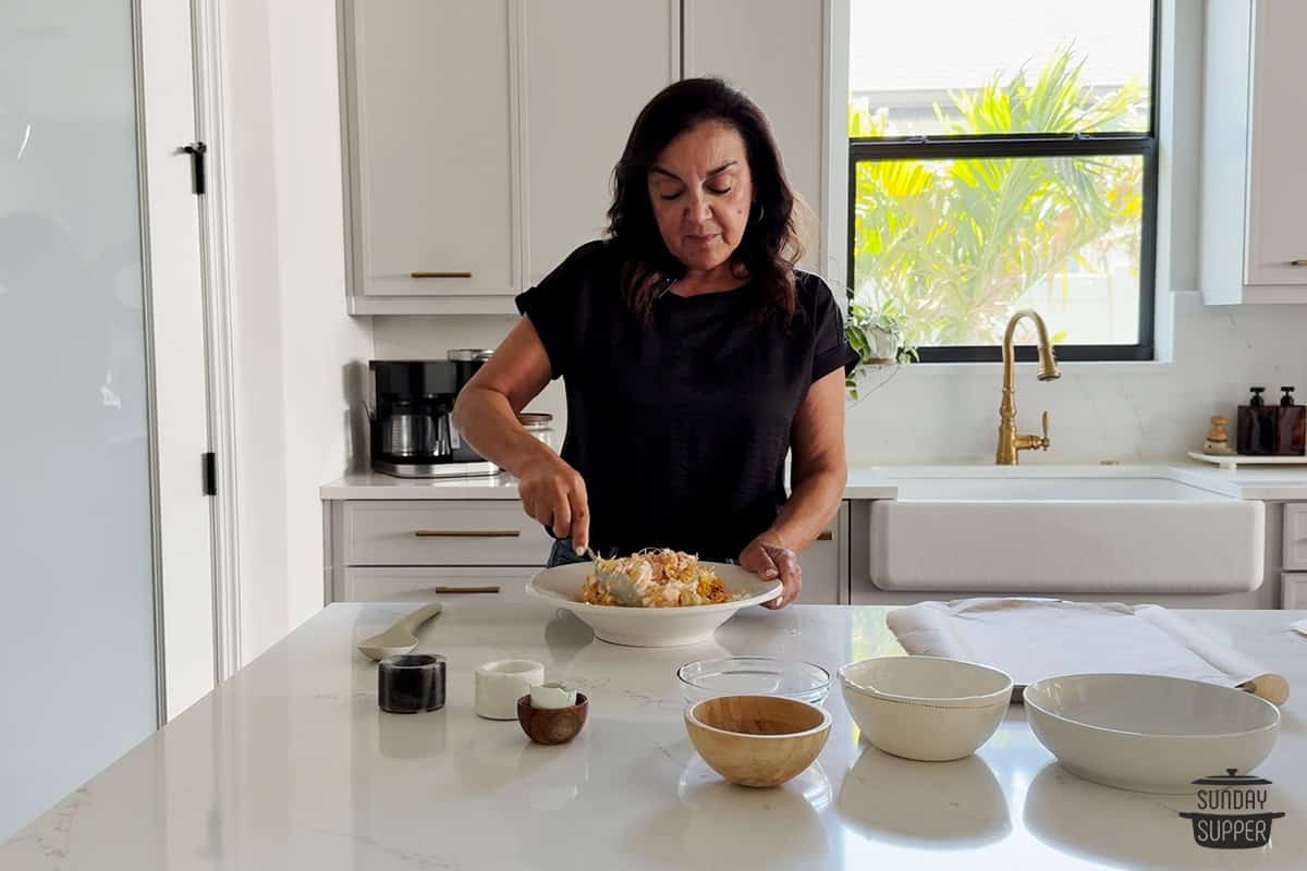 isabel stirring chicken bites mixture in a bowl