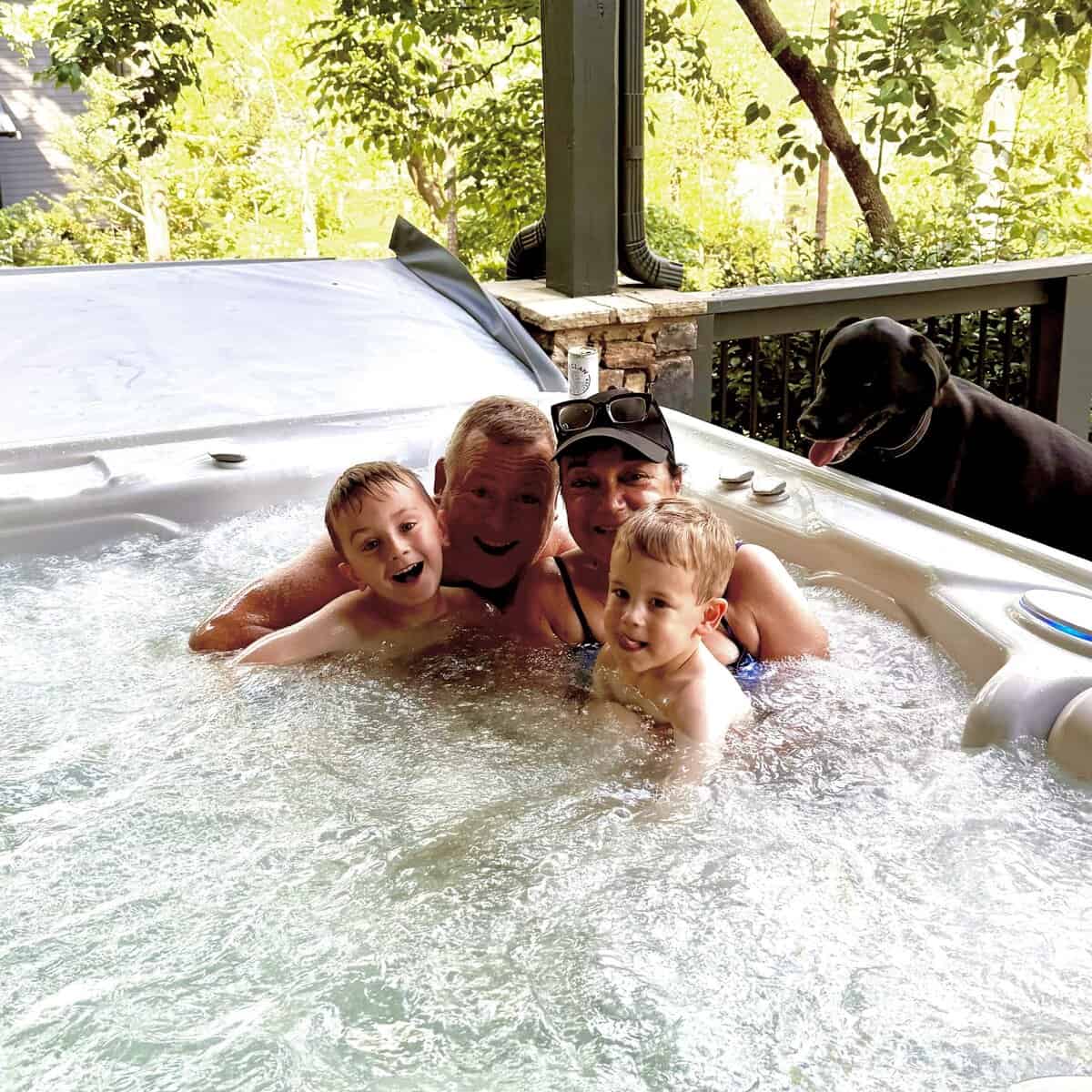 Isabel, Ron, Rory, and Aiden all in the hot tub