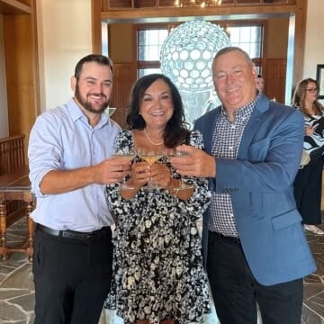 isabel, ron, and ronnie at the clubhouse for dinner